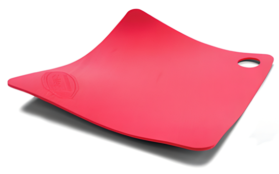 A bright red flexible cutting board with rounded edges; it has a hole for hanging and is slightly elevated at the corners.