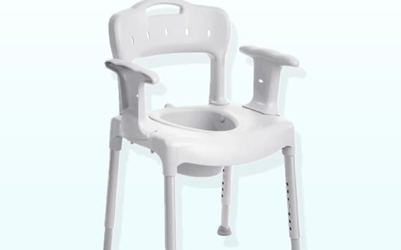 White shower chair with armrests and backrest on light blue background; four legs with rubber tips for stability.
