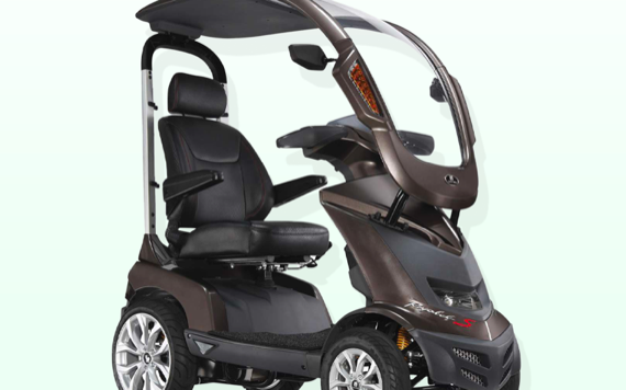 A modern mobility scooter with roof, side mirrors, comfy seat, four big wheels, futuristic metallic design on a light background.