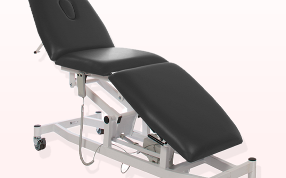 A black adjustable massage table with wheels and a headrest is on a white background; features include a metal frame and control panel.