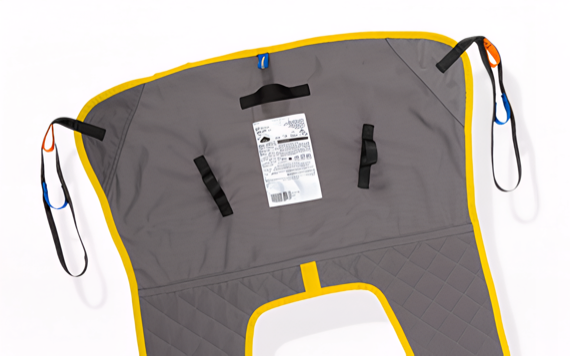 A gray and yellow fabric lift sling with loops and black straps. Center label has specifications, loops have color-coded accents.