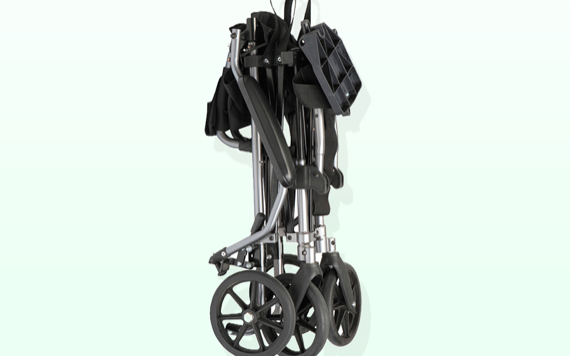 A folded mobility aid with large black wheels, silver frame, and black seat stands against a light green background.