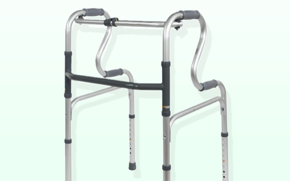 A silver walker with two curved handles, black grips, and adjustable legs is set against a light grey background.
