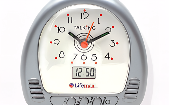 A silver alarm clock with analog and digital time displays, showing 12:50. Brand Lifemax is in red and blue.