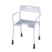 White shower chair with adjustable height, backrest, armrests, drainage holes and non-slip feet, front angle view.