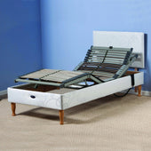 Restwell Devon electric adjustable bed base with adjustable head and flexible slats on carpet, side view.