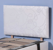 Upholstered damask headboard with wooden slat bed frame, shown against a blue wall, front view.