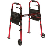 Red folding walker with two front wheels, adjustable legs and black side pouches, shown from the front.