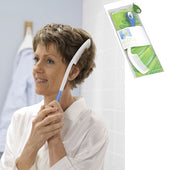 Woman combing her hair with an Etac Comb (Long), Etac product packaging visible in the top right, in use view.