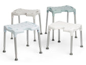 Four blue Etac Swift shower stools with hygiene cut-outs and metal legs, grouped together on a white background, front view.
