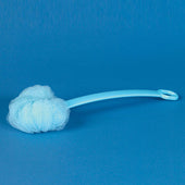 Homecraft long handled net sponge in light blue, shown lying flat on a blue surface with a blue background, side view.