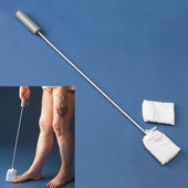 Long handled toe washer with grey grip and two spare sponges, cleaning a lower leg, blue background, in use.