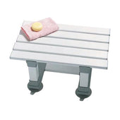 White plastic bath seat with slatted design and reinforced frame, small size, shown from side view.
