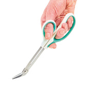 Easi-Grip Chiropodist Scissors with white and green handles held in a hand, white background, in use view.