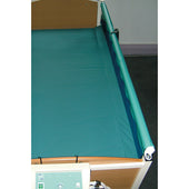 Sidhil hospital bed with teal side rail protectors, profiling mattress infill, and foot-end control panel, side view.
