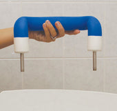Aquajoy Bath Lift Head Rest with two metal rods held by hand, tiled wall background, close-up.