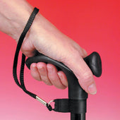 Black Able2 Cane Strap with ergonomic handle, wrist loop, and carabiner clip held in a hand, close-up view.