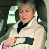 Older woman using Able2 Seat Belt Reacher to adjust seatbelt for comfort, in use side view.