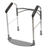 Silver folding toilet frame with black padded handles and a wide base, front angle view.