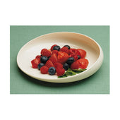 Able2 GripWare plastic scoop dish with strawberries, blueberries and mint sprig on a green surface, top view.