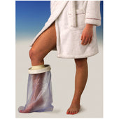 Adult wearing a bathrobe with Able2 Waterproof Cast Protector on left lower leg, in use, side view.