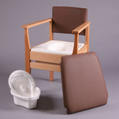 Deluxe commode with hardwood frame, padded seat and backrest, removable pan, flower basket design pattern, front angle view.