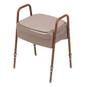 Oatmeal Gordon Ellis Ashby commode stool with adjustable steel legs, armrests and built-in potty, front view.