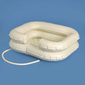 White plastic shampoo basin with side opening, raised edges to reduce splashing, and drainage tube attached, shown from above.