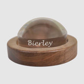 Bierley Dome Magnifier with clear top showing brand name and oak wood base, top view.