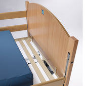 Sidhil Bradshaw Bed Extension Kit frame with blue mattress, metal support visible underneath, close-up view.