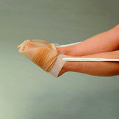 Foot wrapped in pasta like ballet slippers using Homecraft Dorking Tights Aid with white ankle ribbons, in use view.