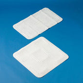 Rectangular white bath mats with grid pattern placed on a soft blue background, top view.