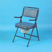 Folding commode with padded seat, metal frame, armrests and removable bucket on a blue background, front view.