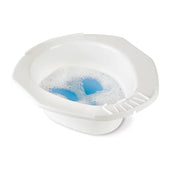 White plastic Homecraft portable bidet with soapy water and built-in soap dish on the rim, top view.