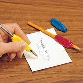 Handwriting with a pen held in a Homecraft Pen & Pencil Holder with cushioned grip, in use close-up.