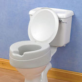 Soft foam raised toilet seat fitted on a white toilet with a blue wall background, front view.