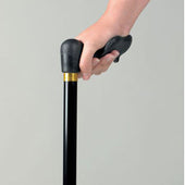 Hand holding black Homecraft Comfy Grip ergonomic adjustable aluminium walking stick, plain background, close-up view.