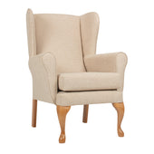 Queen Anne style fireside chair in oyster colour with padded seat and cabriole legs, white background, front angle view.