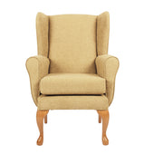Queen Anne style fireside chair in oyster fabric with wooden legs and padded seat, front view on white background.
