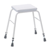 White perching stool with four adjustable legs, rubber tips and square padded seat, shown from front angle.