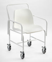 Drive Hallaton mobile shower chair with armrests, push handle, and four braked castors, front view.
