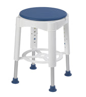 Blue round bath stool with padded rotating seat, adjustable metal legs, and rubber feet for grip, side view.