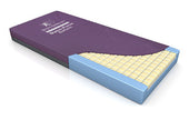 Purple Dynaform Saturn Mattress with layered foam and yellow grid interior, angled view.