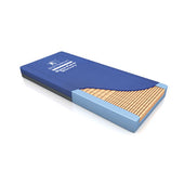 Blue rectangular Direct Healthcare Dynaform Mercury Mattress with corner cutaway revealing castellated foam slats, angled view.