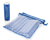 Repose Cushion and Pump pack beside a clear mat with blue edges on white background, front view.