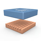 Blue rectangular Dyna-Pad Cushion on tan cylinders, for pressure ulcer prevention, angled view.