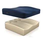 Blue and tan textured foam pressure relief cushion, separated to show top and base layers, angled view.