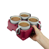 Hand holding a light grey muggi tray with four mugs of tea or coffee, white background, in use view.