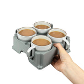 Light grey UK-made muggi tray holding four mugs of tea or coffee, shown in use from above.