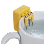 Liquid Level Indicator with metal prongs clipped to a white mug, in use, side view.
